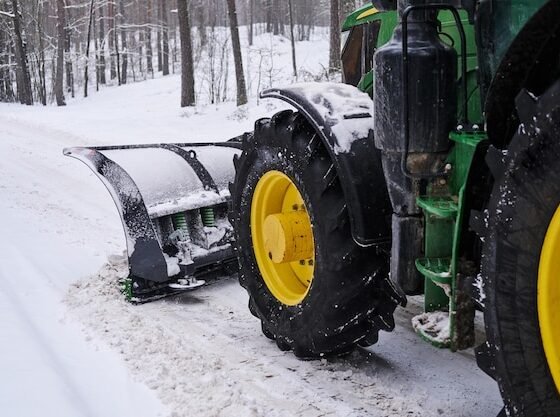 big-special-tractor-is-removing-snow-from-forestal-road_613910-13787